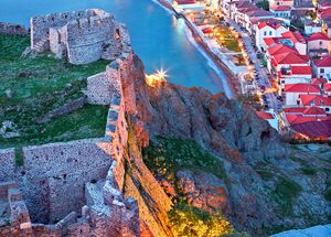 Partial view of the town of Myrina, its castle and the beach you of Romeikos Gyalos