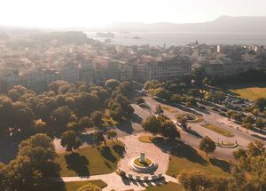 Take a moment to walk through the grass-filled Spianada, with its fountain and cafe and open areas