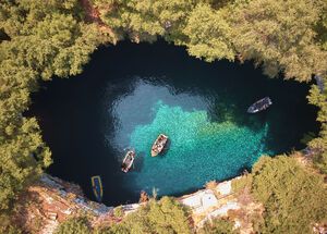 Through a 36m tall opening, the shafts of daylight that come streaming in from above bounce off the water and light up the chamber with ethereal blues