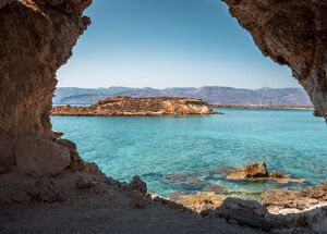 Amazing view through a cave of Koufonisi island with magical turquoise waters