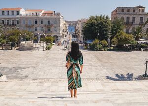 Miaouli Square with its grand Town Hall, palm trees and cafes and shops