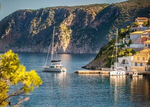 Beautiful landscape with bay and colorful buildings on the background in the town of Asos