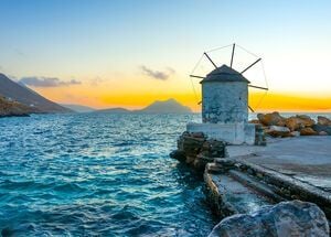 Beautiful old traditional windmill by the port of Aigiali village