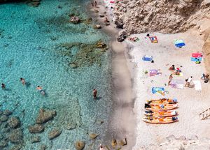 Milos, Greece - September 10, 2015: Top view of canoes at Tsigrado Beach in Milos island, Cyclades,