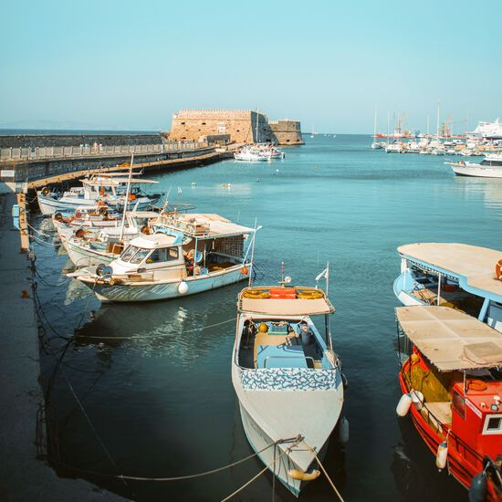 Fishing boats at Heraklion harbour and Koules Fortress