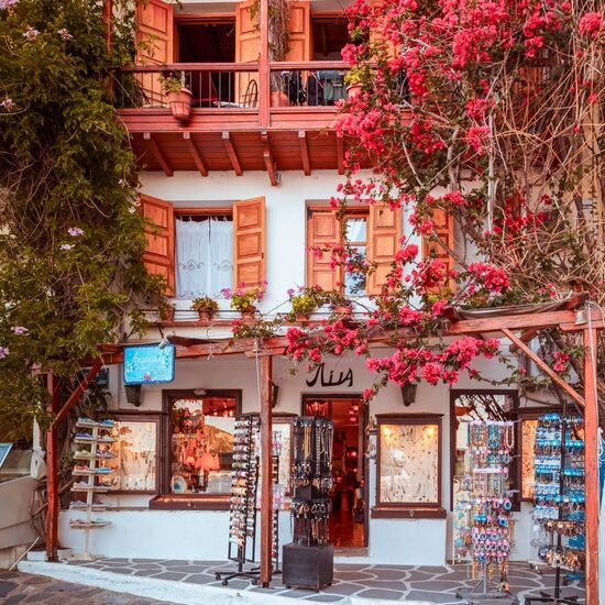 Lagstone streets with whitewashed stairs, flowers on the patios, pretty windowsills, well-kept homes at Skopelos town