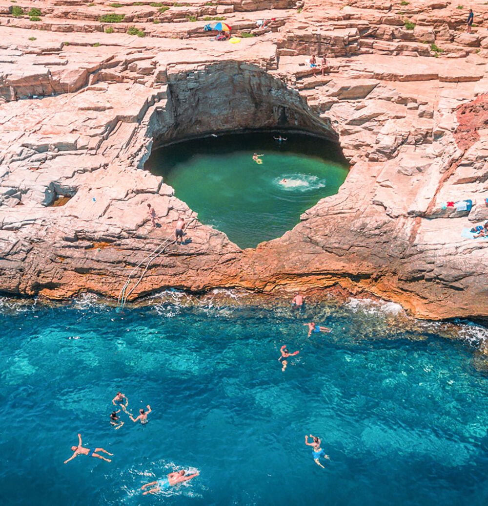 Giola lagoon the natural pool carved into the rock by the sea in Thassos