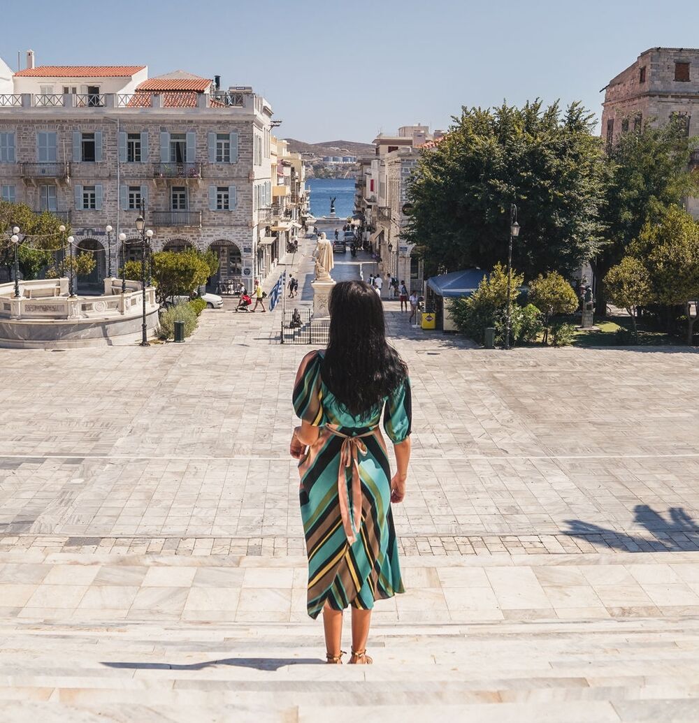 Miaouli Square with its grand Town Hall, palm trees and cafes and shops