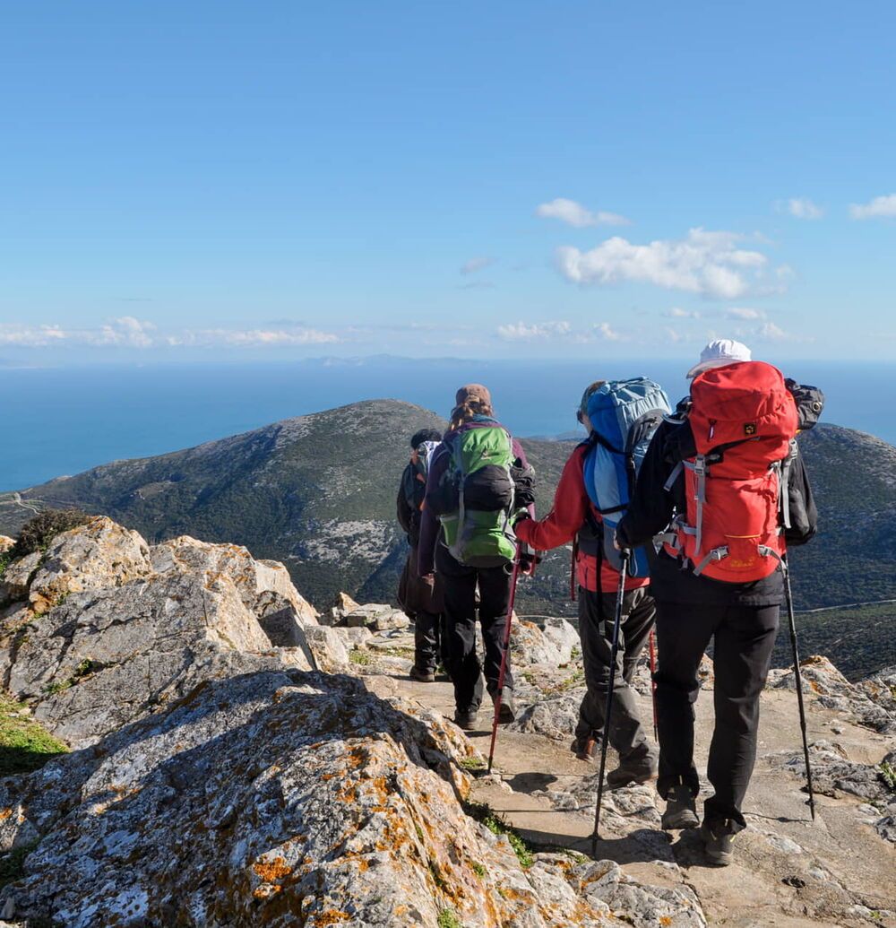 Hicking trail with people looking over the horizon