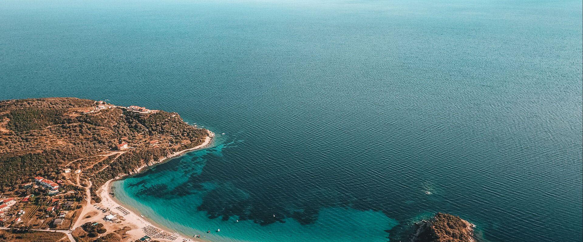Alikes, one of most beautiful and popular beaches on the island, looking onto the Sithonia peninsula