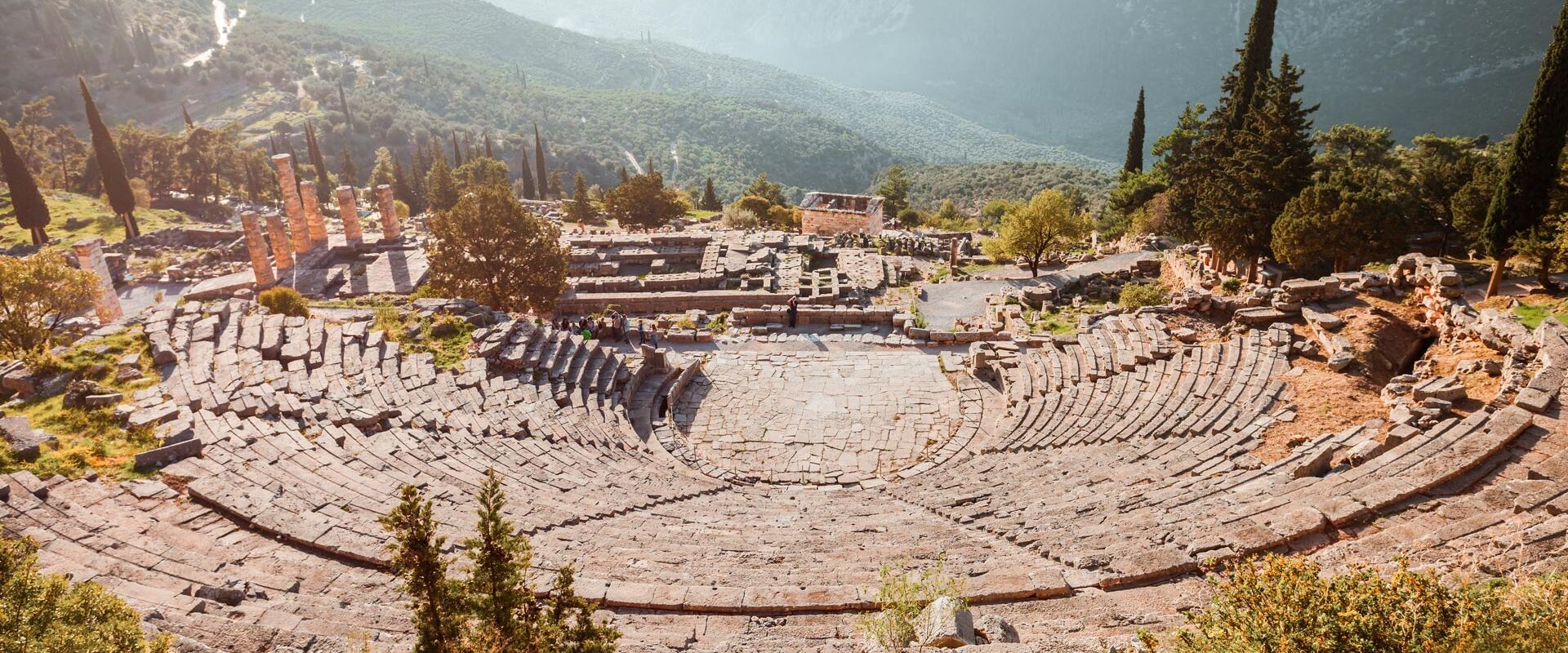 Located above the Temple of Apollo, the Ancient Theatre looks over the entire sanctuary and a valley of olive trees