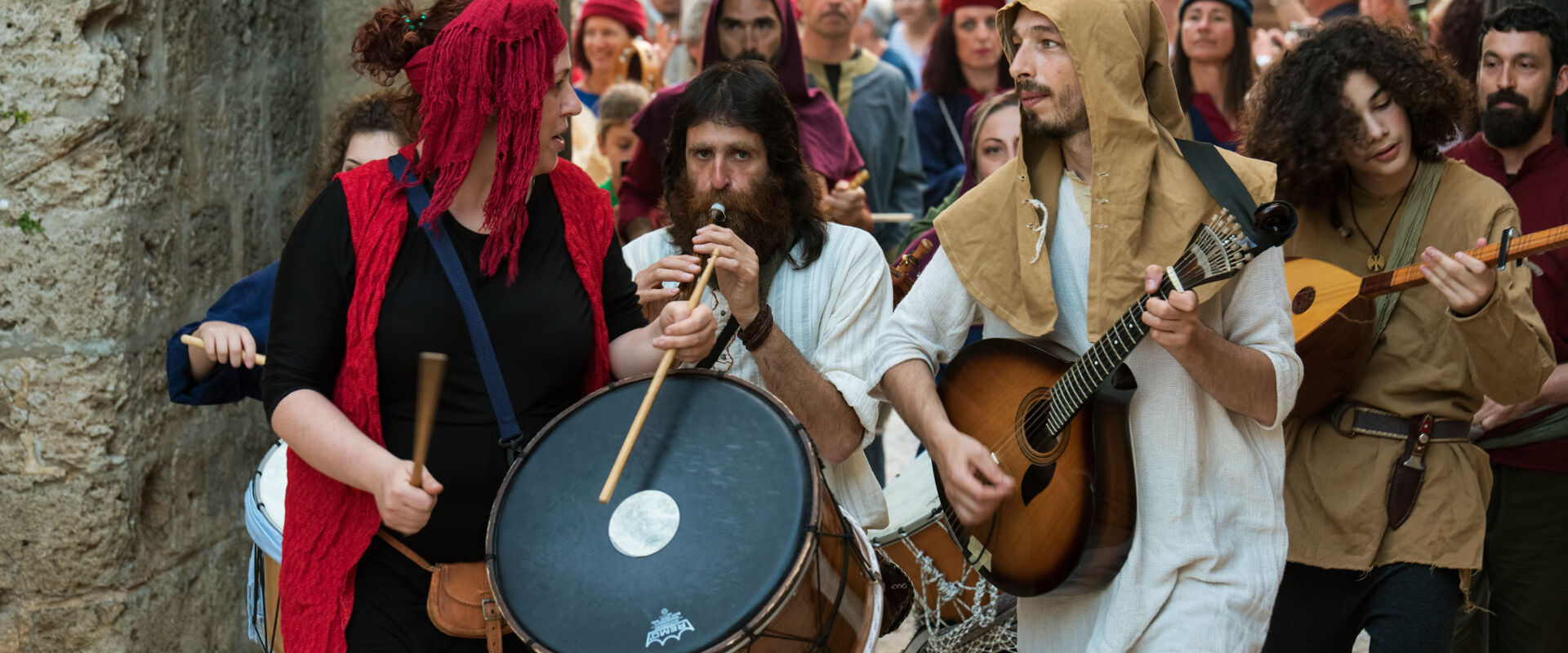 Masked players at the Medieval Rose Festival. The festival is held in Rhodes old town