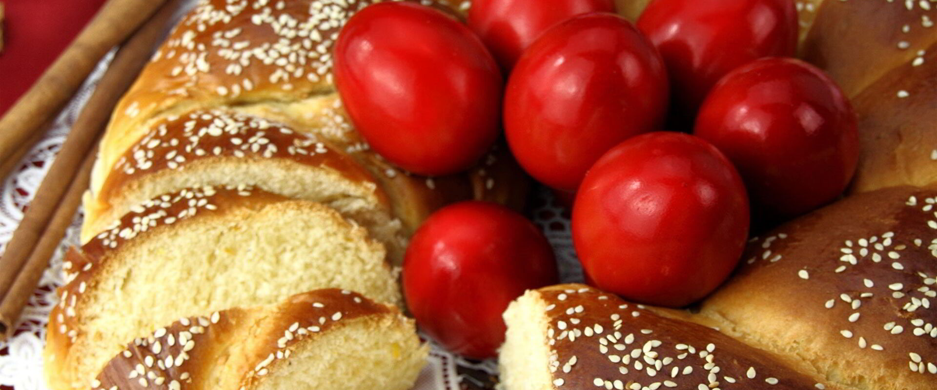 Red Easter eggs and traditional tsoureki brioche