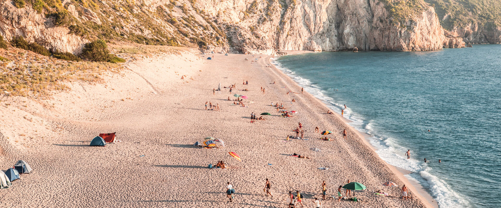 Cliffs that plunge  into the sea at Milos Beach