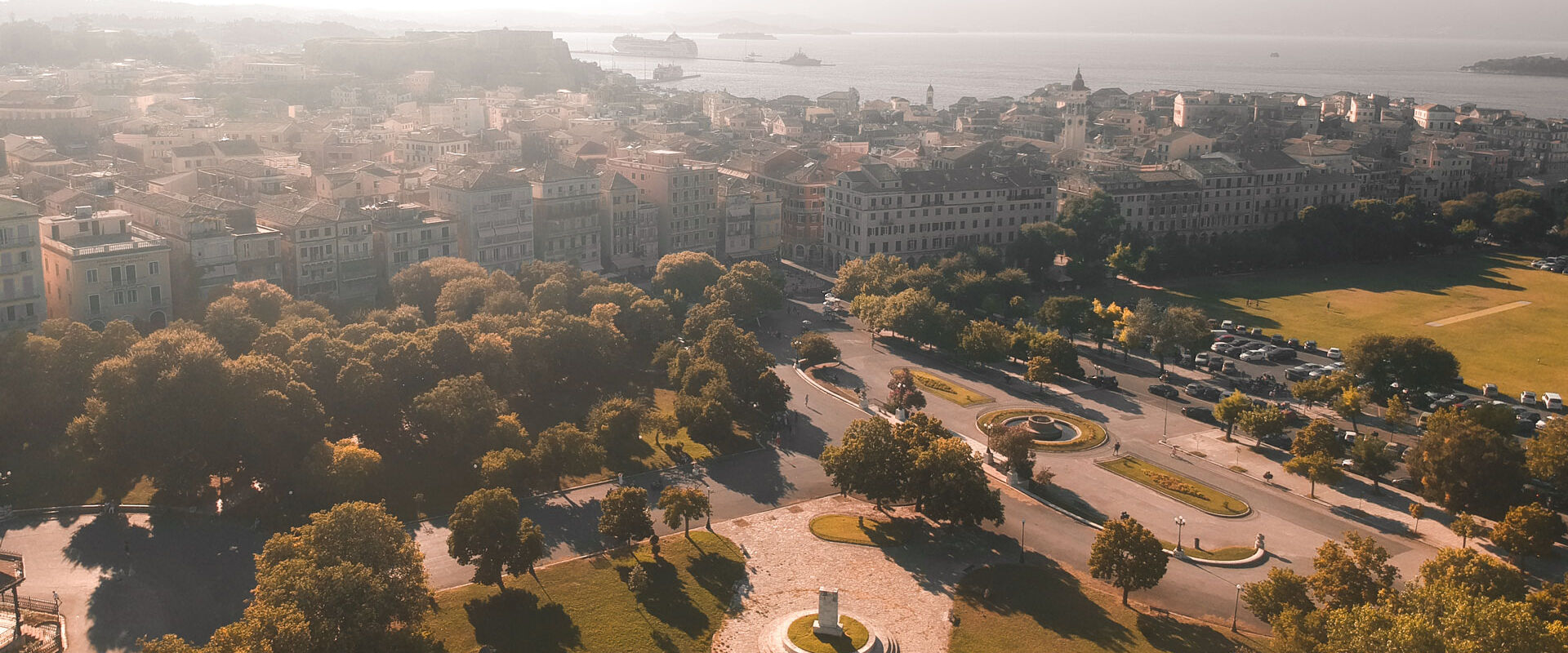 Take a moment to walk through the grass-filled Spianada, with its fountain and cafe and open areas