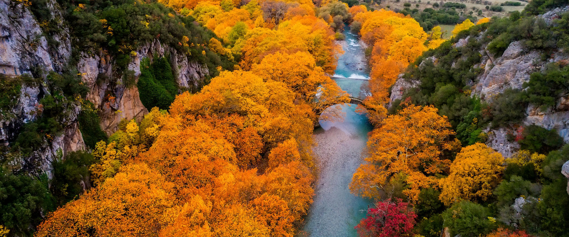 Aerial view of the Old stone bridge in Klidonia Zagoria in the autumn, Epirus, Western Greece. This arch bridge with elongated arch built in 1853.