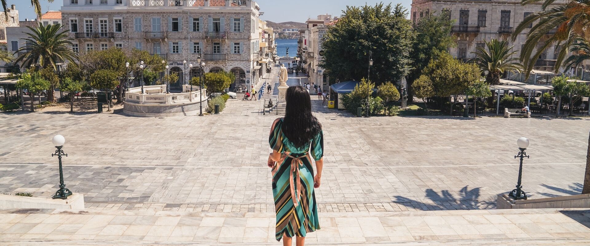 Miaouli Square with its grand Town Hall, palm trees and cafes and shops