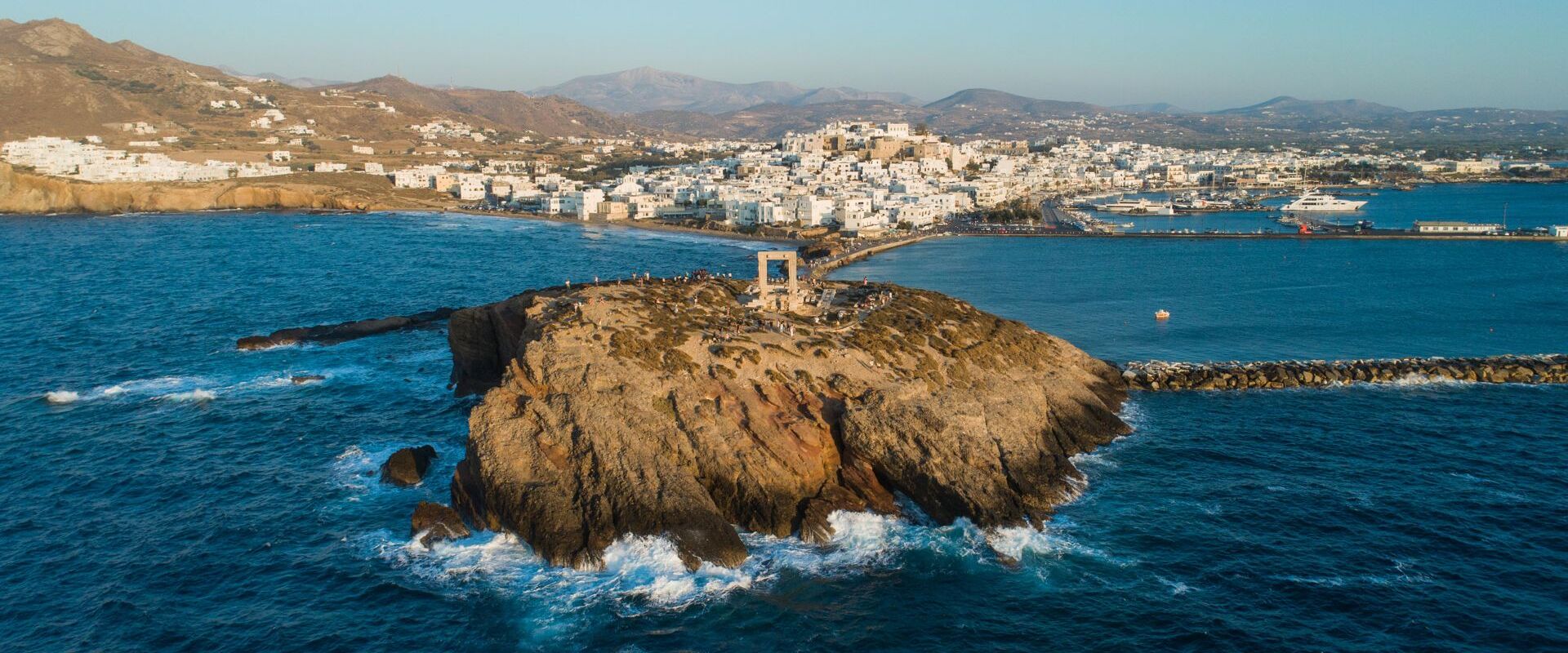 View of Naxos Hora from the little island on which Portara stands, Palatia, is now connected to the mainland