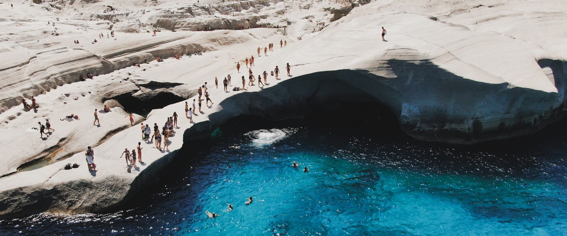 Dive from the limestone-white rocks of Sarakiniko