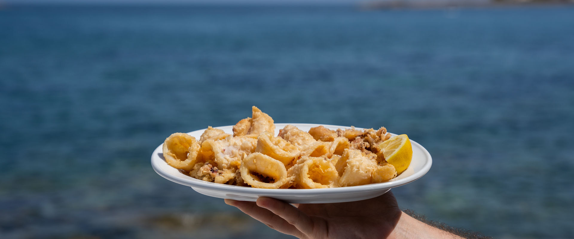 Classic choices include fried or grilled squid (kalamari)