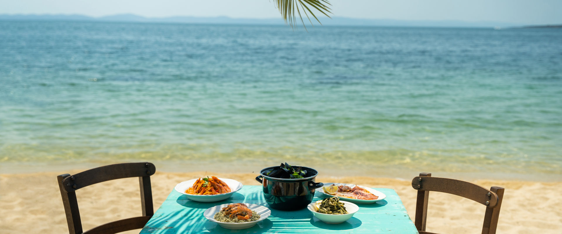 You could be ordering seafood in a taverna by the beach