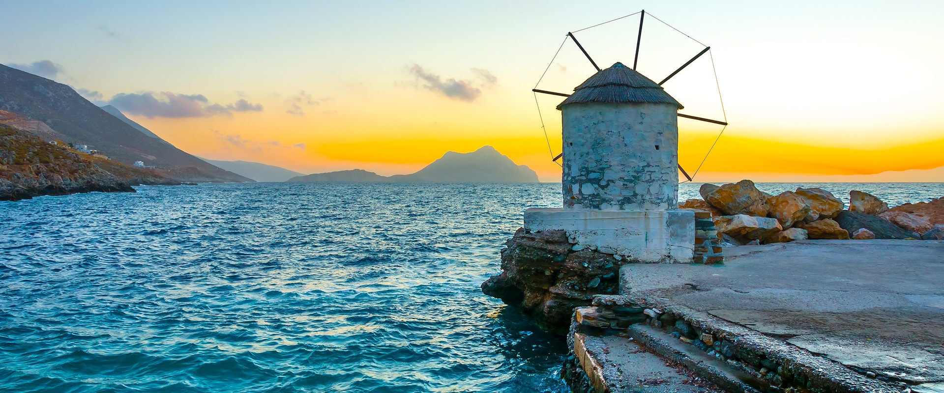 Beautiful old traditional windmill by the port of Aigiali village