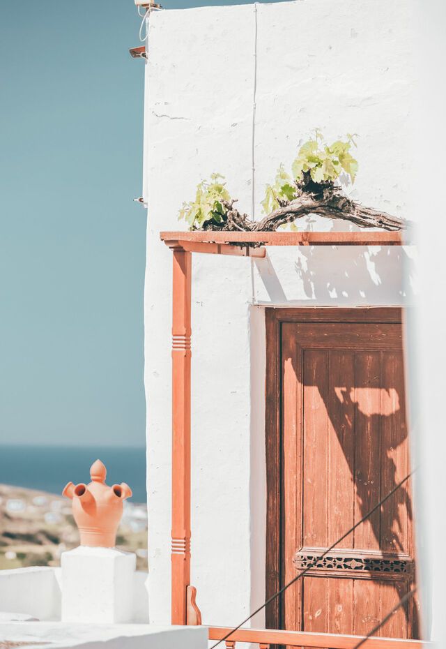 Peer through open doors and windows at the living-rooms proudly decorated with colourful ceramics