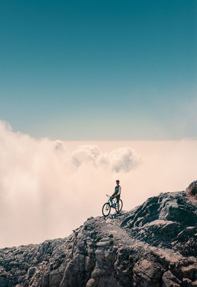 Mountain-biking above the clouds on Mt Olympus