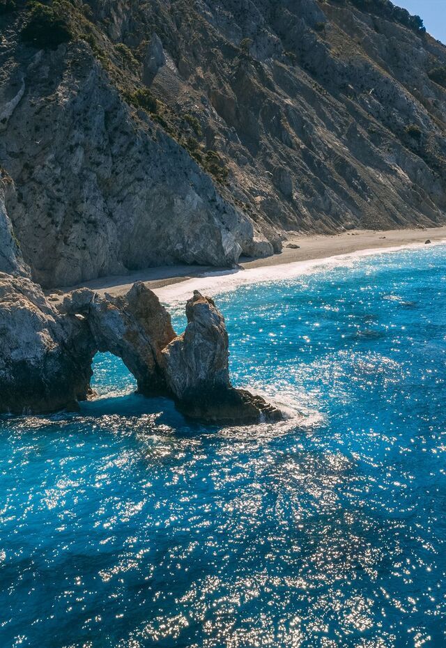 Lalaria beach in Skiathos is unique for its pearly-white pebbles and dramatic cliff setting