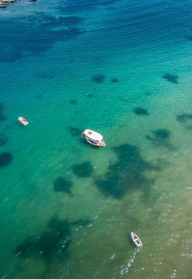 The shallow, green waters of Nea Peramos beach near Kavala