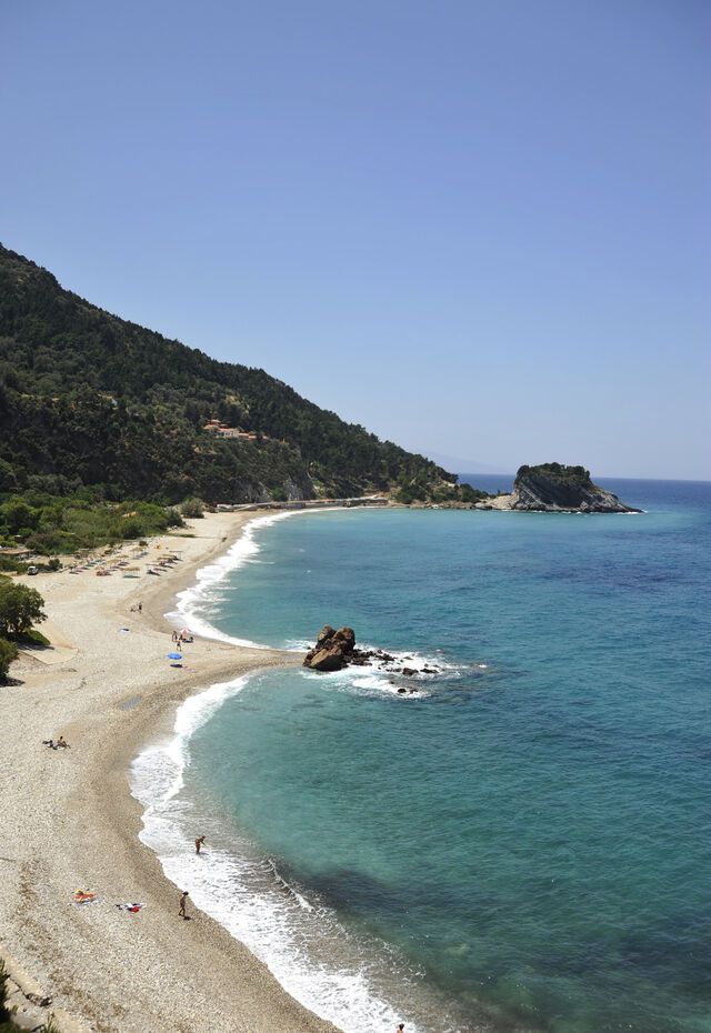 Potami beach in Samos is known for its shiny pebbles and greenery