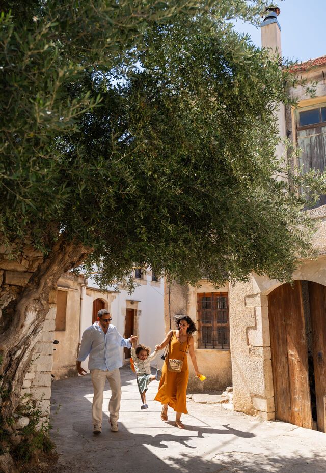 A joyful family moment under the olive tree