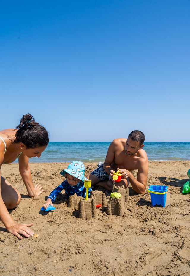 Family play time on the beach is always fun