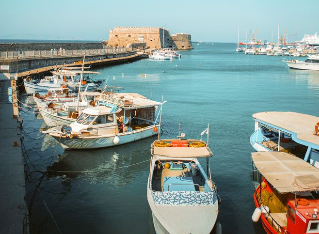 Fishing boats at Heraklion harbour and Koules Fortress