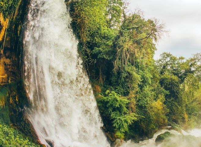 Famous Keranos waterfall drops 70m among plane trees that were seeded centuries hence