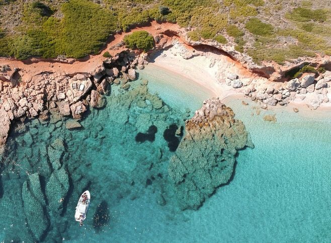 The southern part of the island is embroidered with beaches, charming bays and green-blue water
