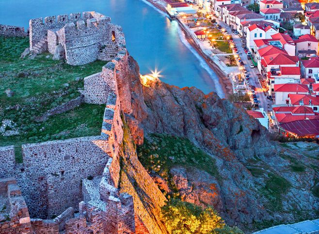 Partial view of the town of Myrina, its castle and the beach you of Romeikos Gyalos