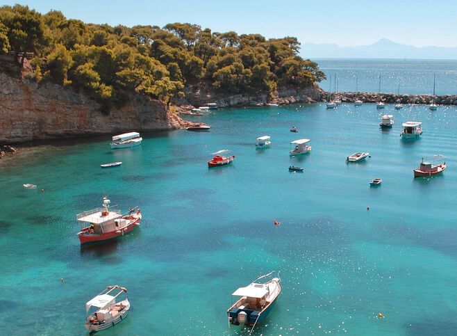 Small boats moored in the harbour of Votsi fishing village
