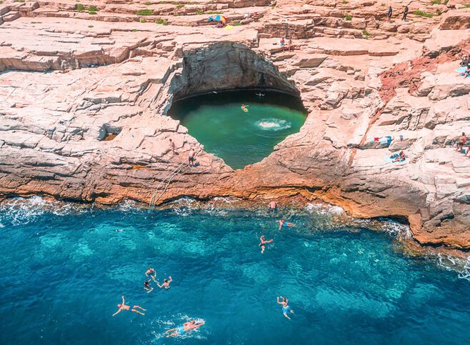 Giola lagoon the natural pool carved into the rock by the sea in Thassos