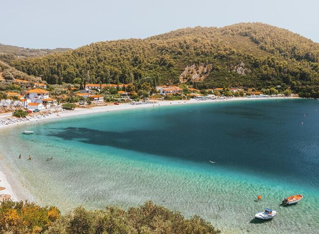 In a setting of tranquil green and blue, Panormos is one of the most welcoming beaches in Skopelos
