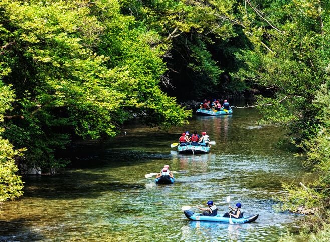 Adventure teams doing rafting on the cold waters of the Voidomatis 