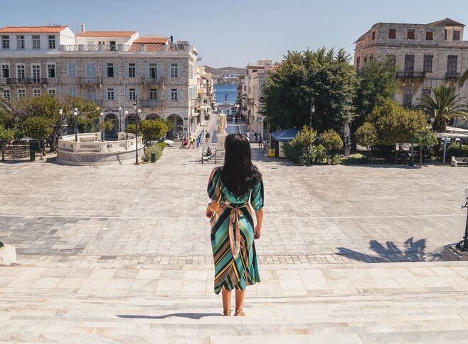 Miaouli Square with its grand Town Hall, palm trees and cafes and shops