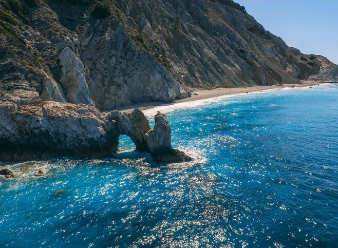 Lalaria, up on the north coast of Skiathos is unique for its smooth, pearly-white pebbles and dramatic cliff setting