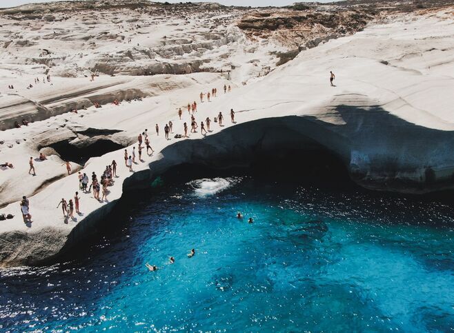 Dive from the limestone-white rocks of Sarakiniko