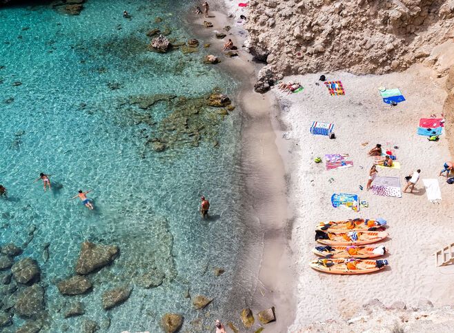 Milos, Greece - September 10, 2015: Top view of canoes at Tsigrado Beach in Milos island, Cyclades,