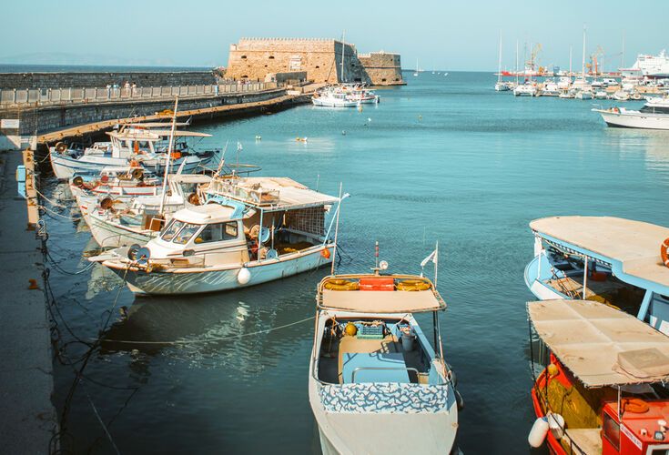 Fishing boats at Heraklion harbour and Koules Fortress