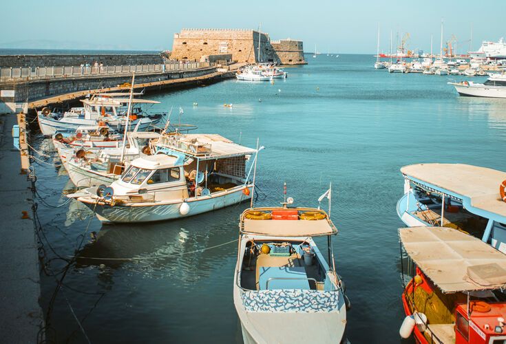 Fishing boats at Heraklion harbour and Koules Fortress