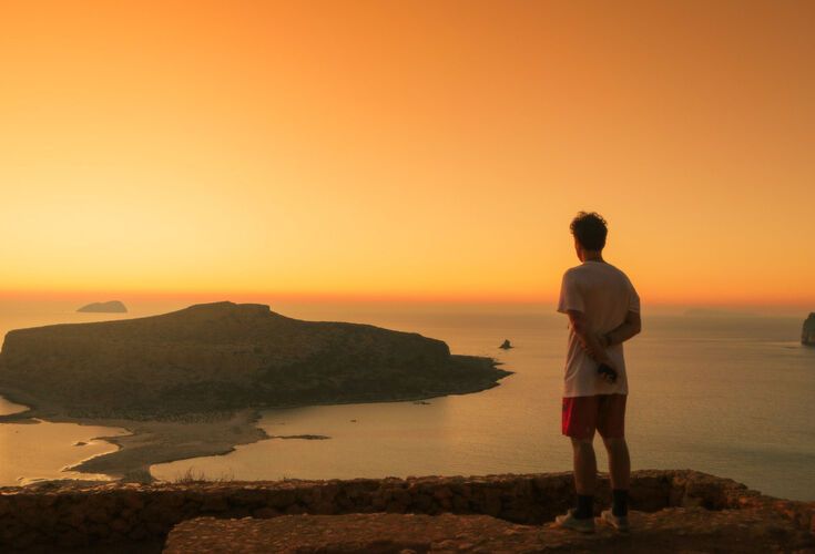 Watching the sunset at Balos beach from above, one of the most beautiful beaches of Crete and Europe