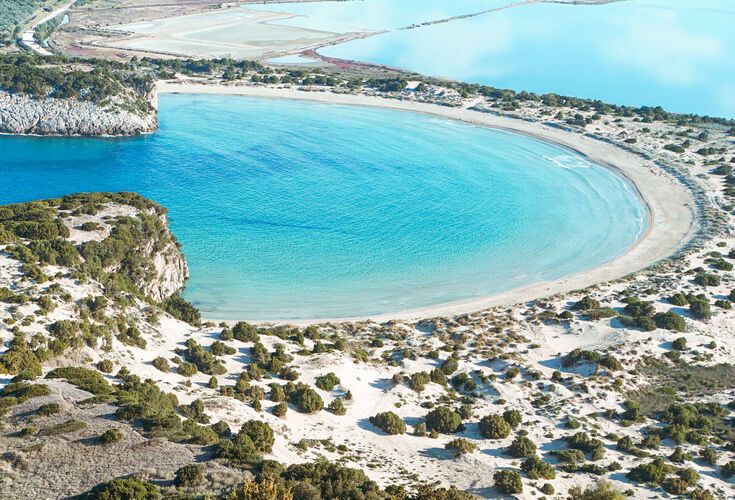 From ground level, the scene is scarcely less impressive than the iconic horseshoe-shaped image of the beach photographed from above