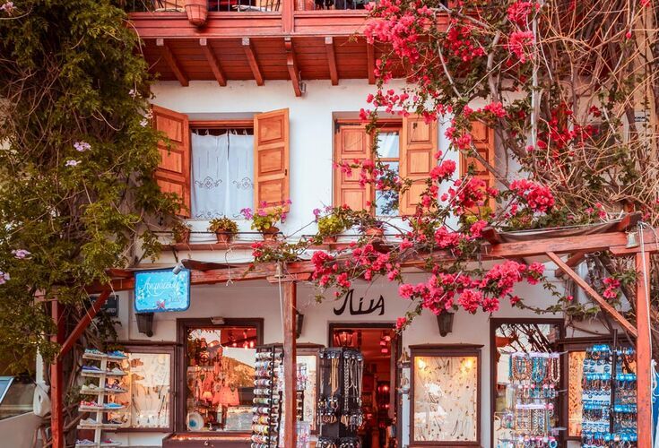 Lagstone streets with whitewashed stairs, flowers on the patios, pretty windowsills, well-kept homes at Skopelos town